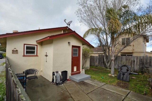 back of property with a patio area