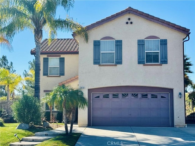 mediterranean / spanish-style house featuring a garage