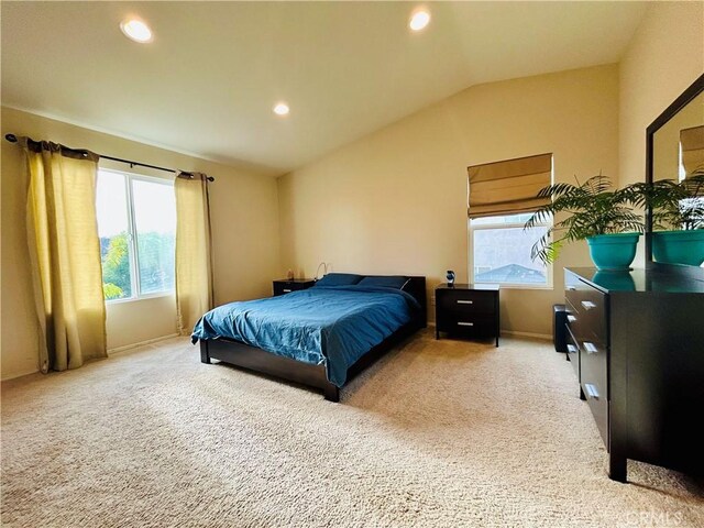 bedroom with carpet flooring and lofted ceiling