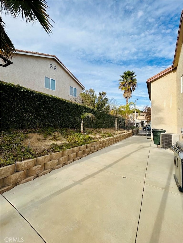 view of side of home featuring a patio area