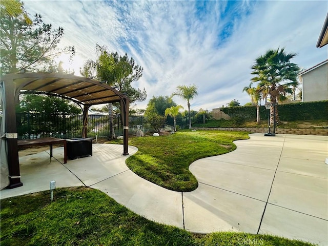 view of property's community featuring a patio area and a lawn