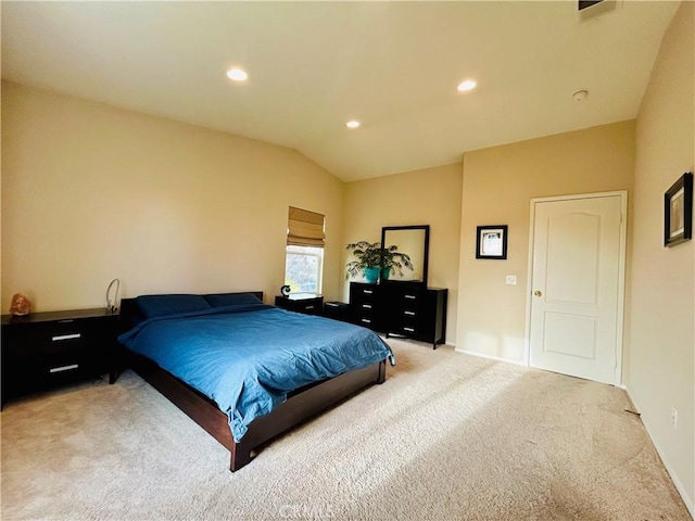 carpeted bedroom featuring vaulted ceiling