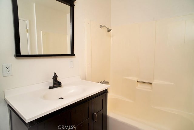 bathroom with vanity and bathing tub / shower combination