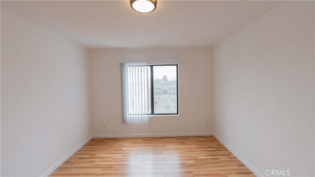 spare room featuring light hardwood / wood-style floors