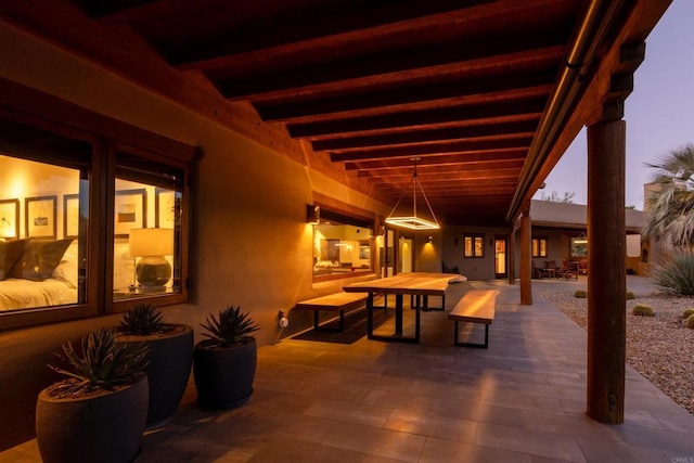 view of patio terrace at dusk