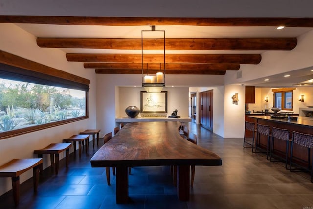 game room featuring beamed ceiling