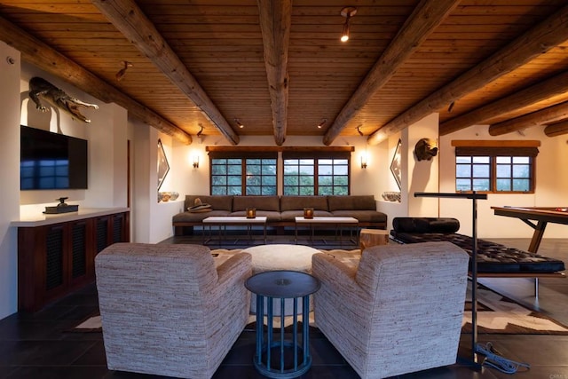 living room with track lighting, beamed ceiling, and wooden ceiling