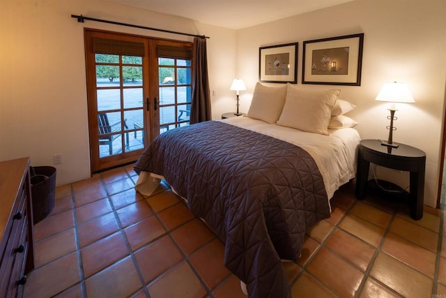 tiled bedroom with access to exterior and french doors