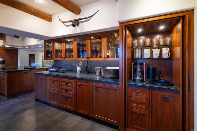 bar featuring extractor fan, beamed ceiling, and decorative backsplash