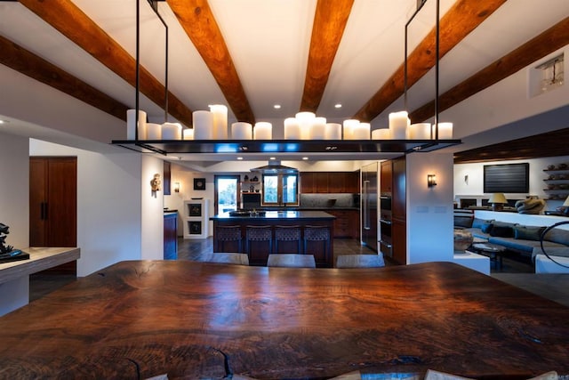 dining room with beamed ceiling