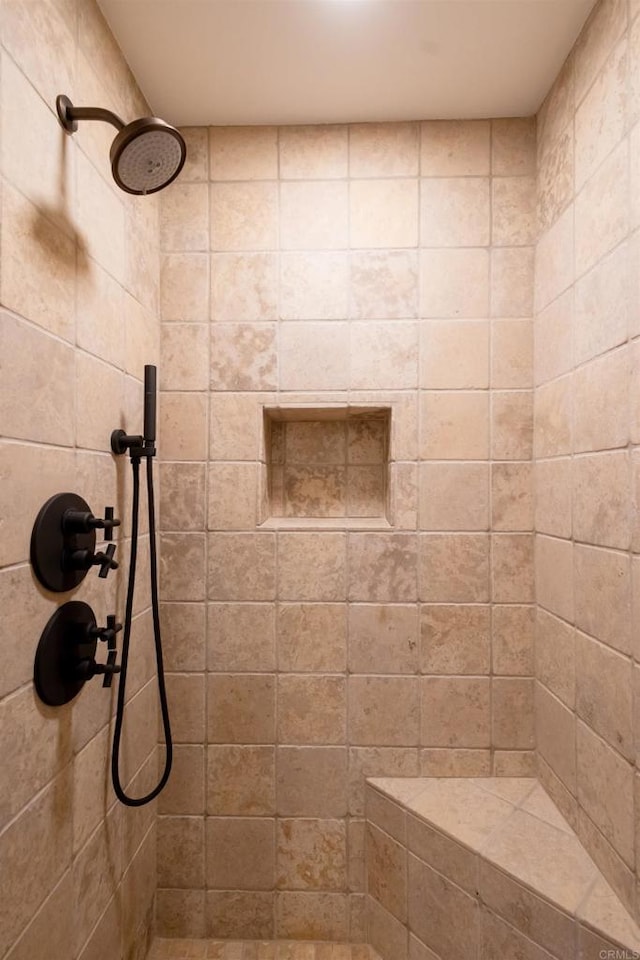 bathroom with tiled shower