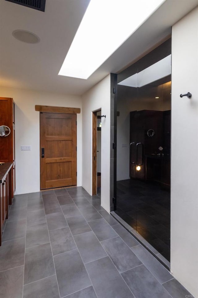 hallway with a skylight