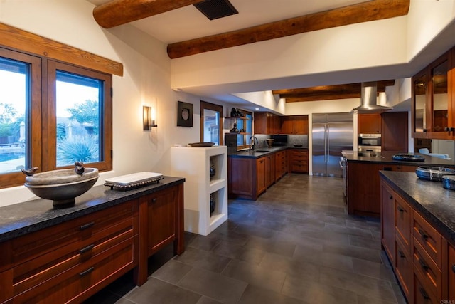 kitchen with sink, stainless steel appliances, and extractor fan