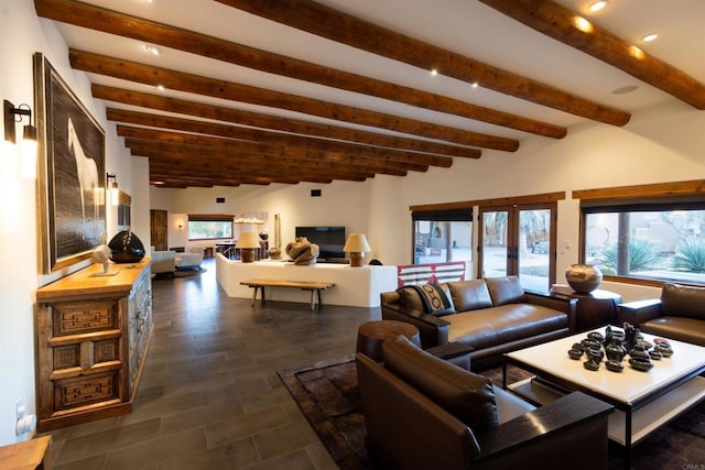 living room featuring a wealth of natural light, beam ceiling, and french doors