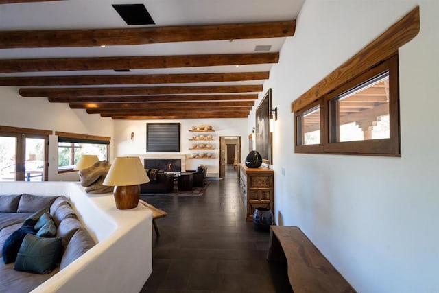 living room with beam ceiling