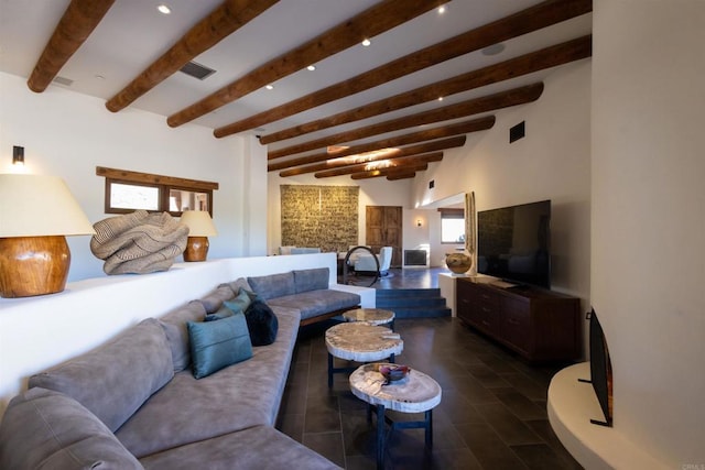 living room featuring beam ceiling