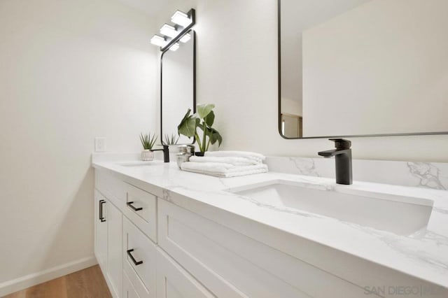 bathroom featuring vanity and hardwood / wood-style flooring