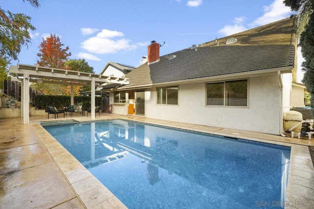 view of pool featuring a pergola and a patio