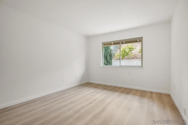 unfurnished room featuring light wood-type flooring