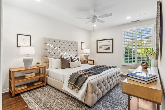 bedroom with ceiling fan and dark hardwood / wood-style flooring