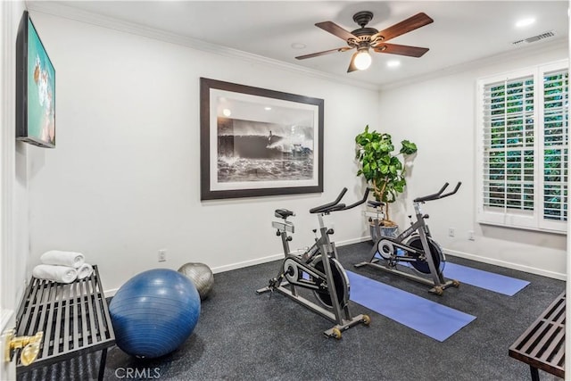 exercise room with carpet floors, ceiling fan, and ornamental molding