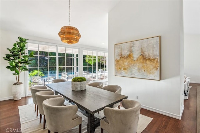 dining space featuring dark hardwood / wood-style floors and a healthy amount of sunlight