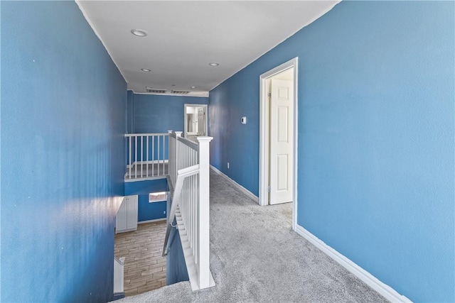 corridor with light colored carpet