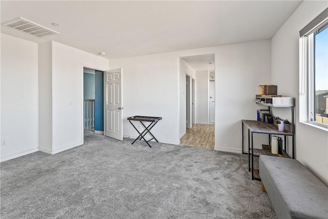 unfurnished room with light carpet