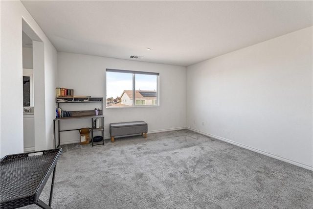 misc room featuring light colored carpet