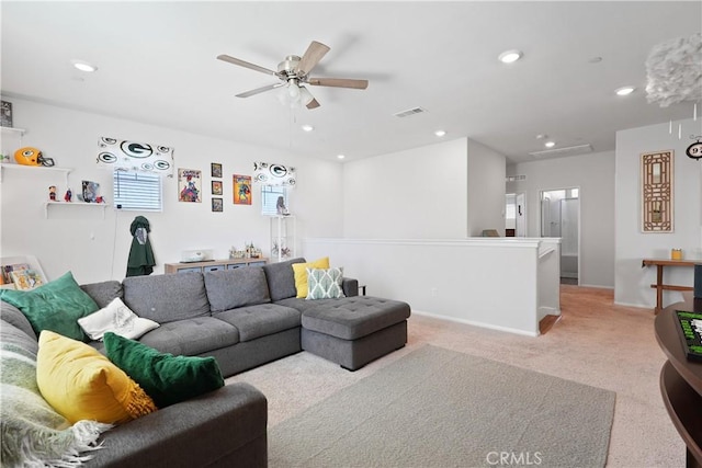 living room featuring ceiling fan and light colored carpet