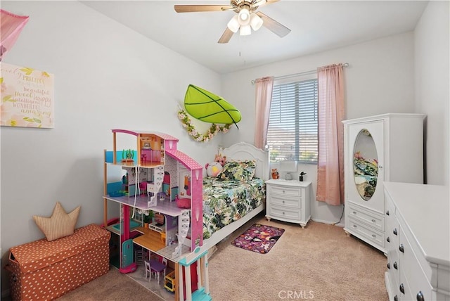 bedroom with ceiling fan and light carpet