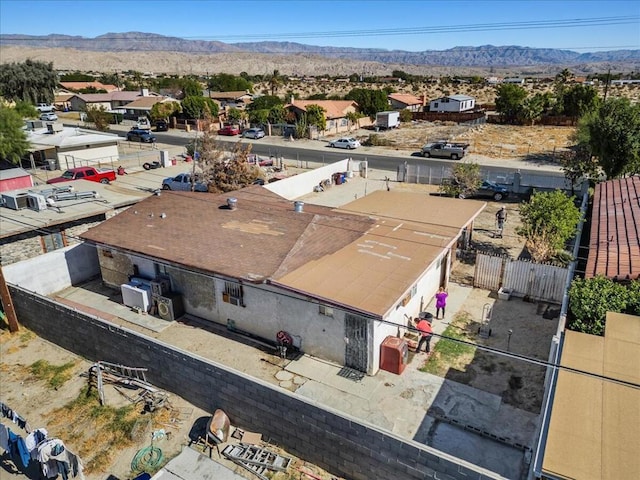 birds eye view of property featuring a mountain view