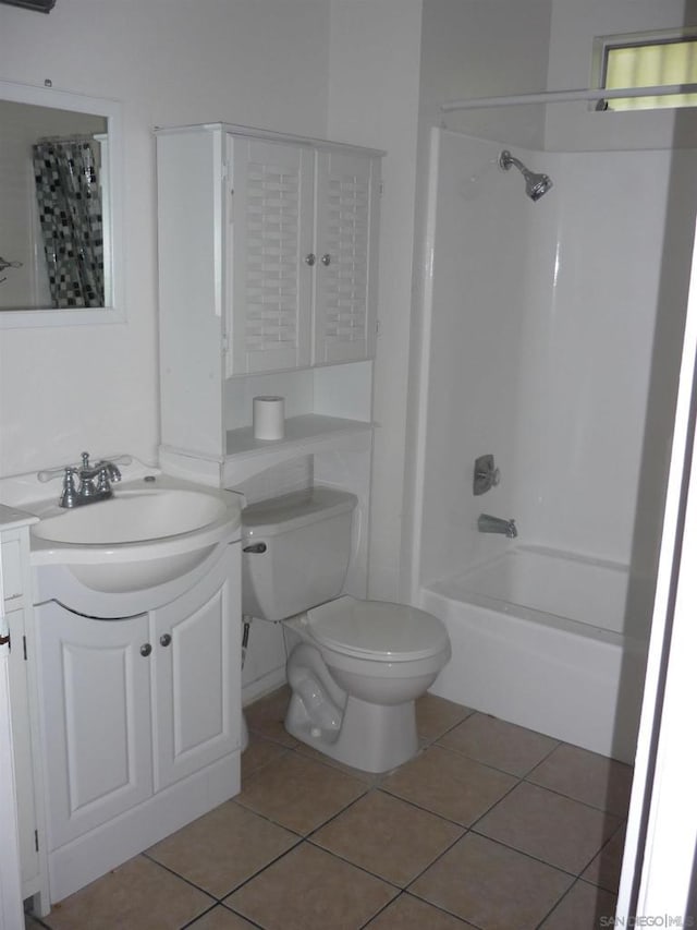 full bathroom featuring tile patterned floors, vanity, bathing tub / shower combination, and toilet