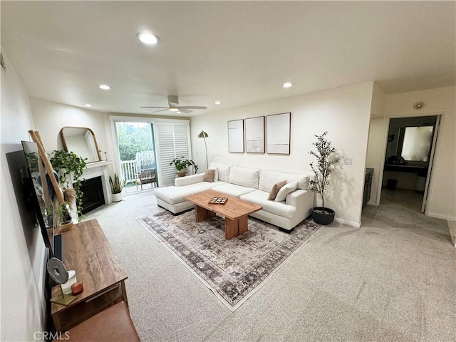 living room with ceiling fan and light carpet