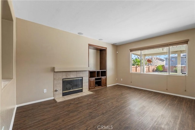 unfurnished living room with hardwood / wood-style floors and a fireplace