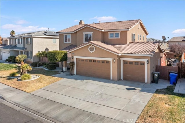 view of front of home with a front yard and a garage