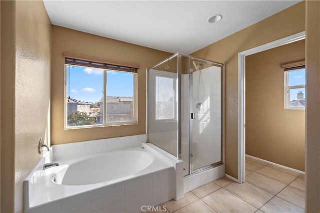 bathroom featuring plus walk in shower and tile patterned floors