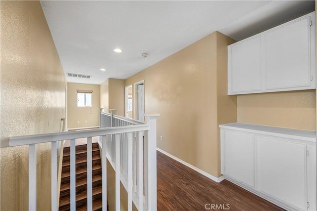 hall with dark hardwood / wood-style floors