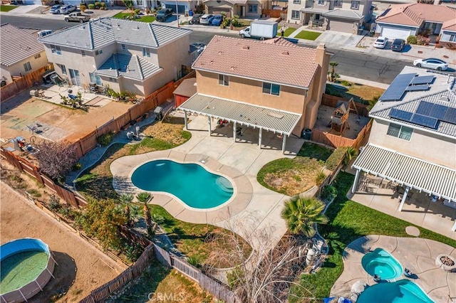 view of swimming pool with a patio area