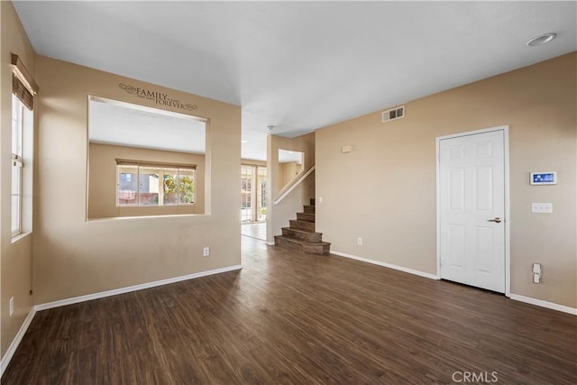 empty room with dark hardwood / wood-style floors