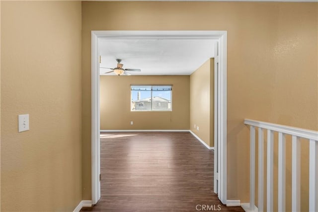 hall with hardwood / wood-style floors