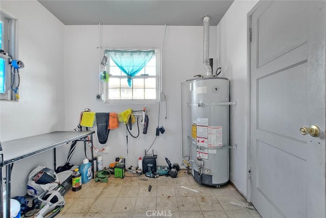 utility room featuring strapped water heater