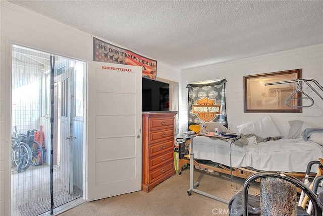 carpeted bedroom with a textured ceiling