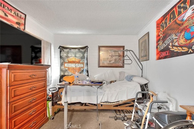 bedroom with ornamental molding, carpet flooring, and a textured ceiling