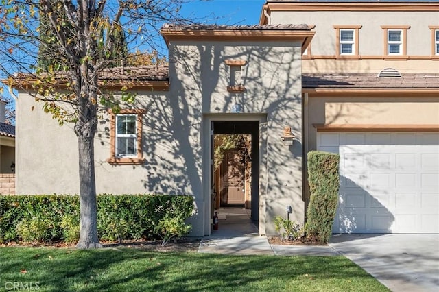 doorway to property featuring a garage