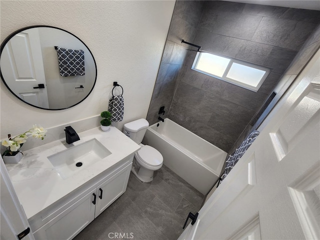 full bathroom with toilet, tiled shower / bath combo, and vanity