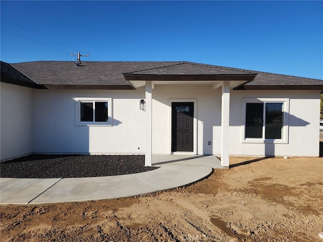 entrance to property with a patio area