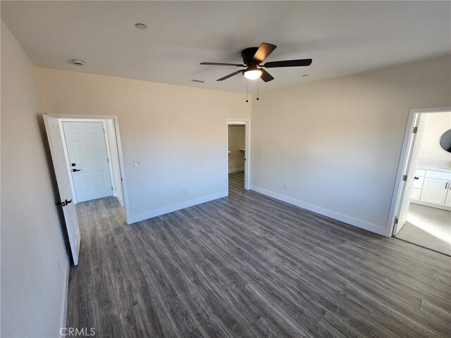 unfurnished bedroom with dark wood-type flooring and ceiling fan