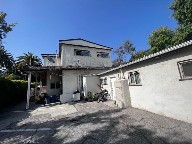 back of property with a patio