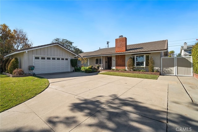 ranch-style house with a garage and a front yard